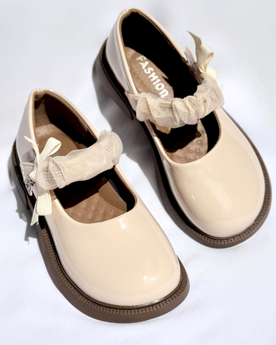 Shoes with a strap and the letter A, School